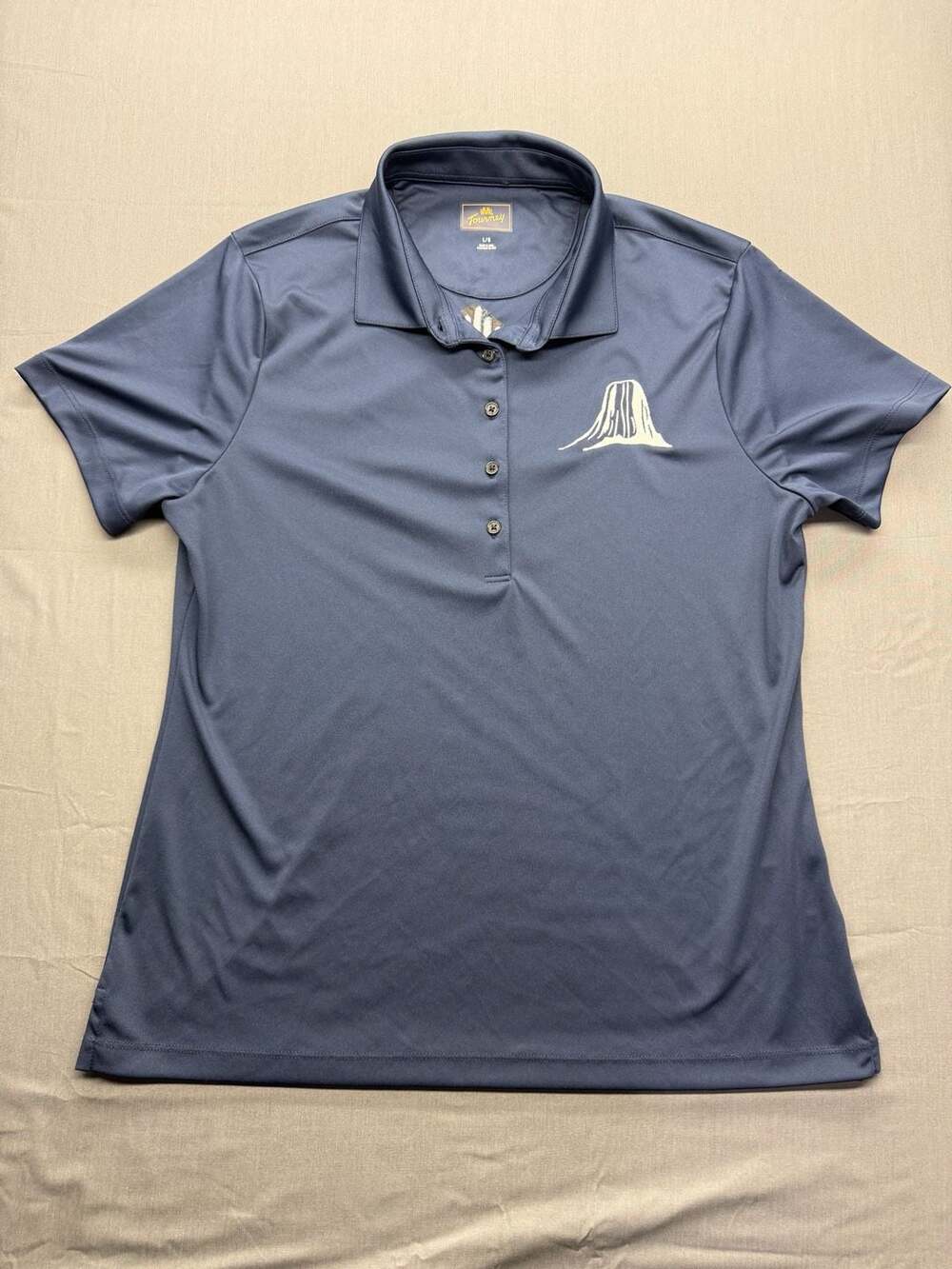 Tourney Women's Navy Performance Polo Shirt with Devils Tower Logo